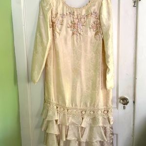 This beautiful ivory dress is the top of the line